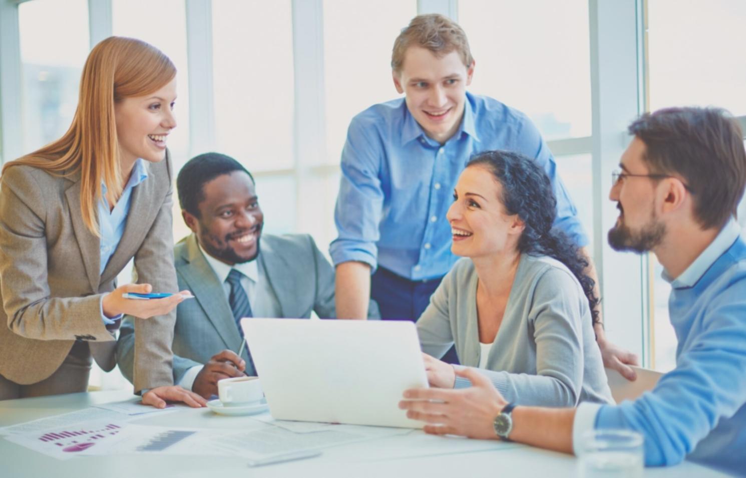 Budget planning workshop session with participants reviewing financial documents
